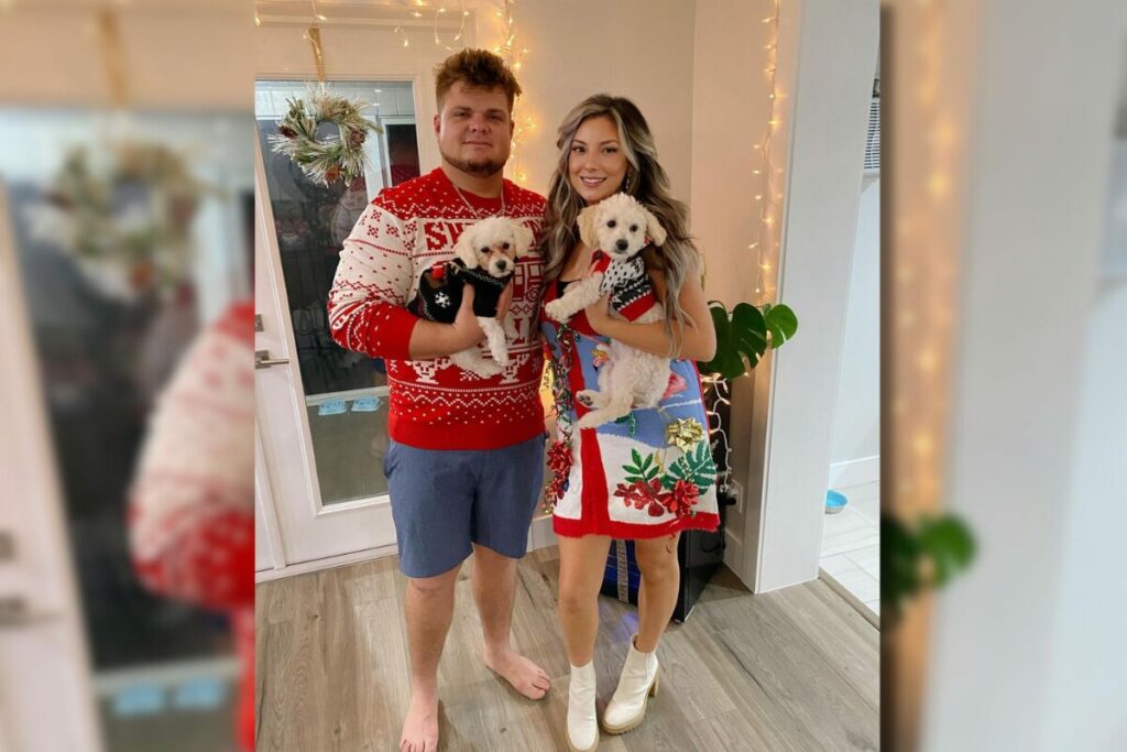 Kristina Russii and Daniel holding their cute puppies